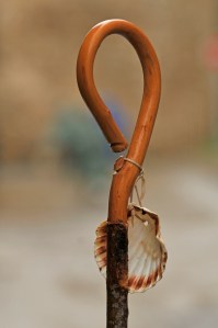 The badges of a pilgrim, his shell and his stick.
