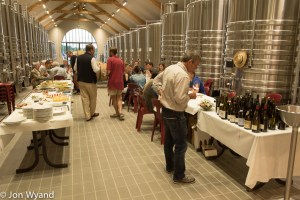 Eric Rousseau examines what's on offer while Brice de la Morandière from Domaine Leflaive chats with Pierre de Benoit from Domaine de Villaine