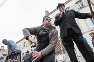 In the streets of Beaune the fun has started at the cork pulling competition.