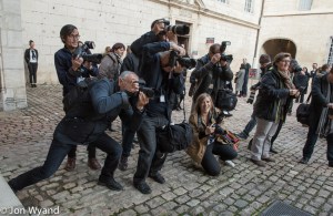 Outside the photographers are busy